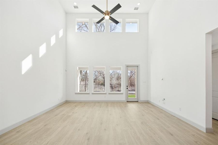 Your new family room is flooded with natural light from a double stacked wall of windows! Your new family room is flooded with natural light from a double stacked wall of windows!