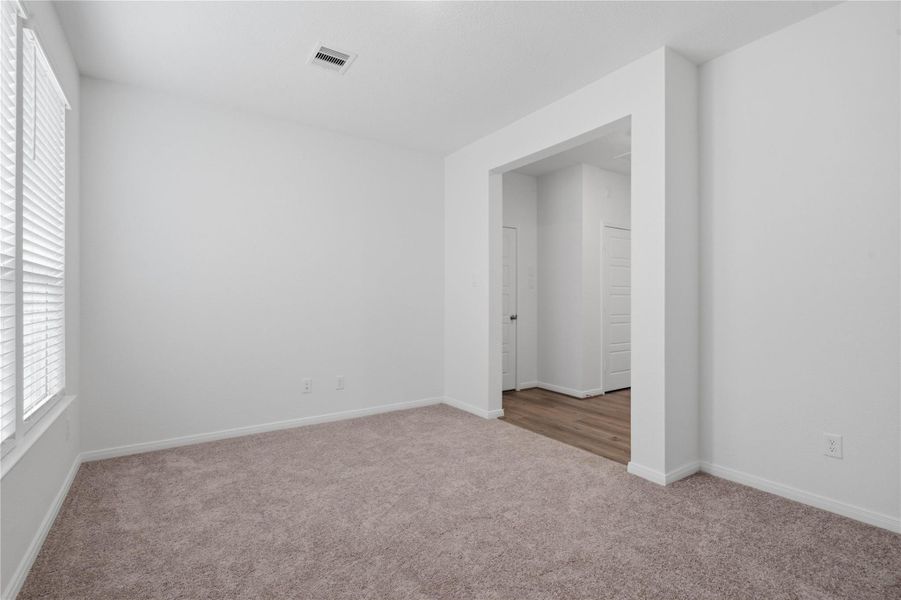 Additional view from the Den into the hallway.