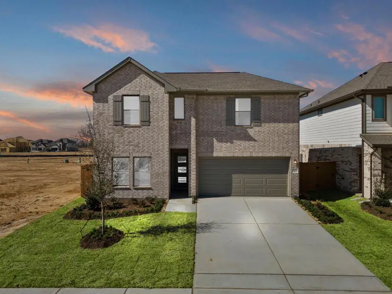 Front exterior of a new home in Cypress Green, Hockley, TX, highlighting curb appeal (Image 23). Front exterior of a new home in Cypress Green, Hockley, TX, highlighting curb appeal (Image 23).