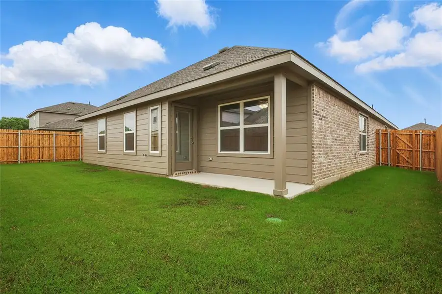Back of house with a patio, a gate, a fenced backyard, brick siding, and a shingled roof Back of house with a patio, a gate, a fenced backyard, brick siding, and a shingled roof