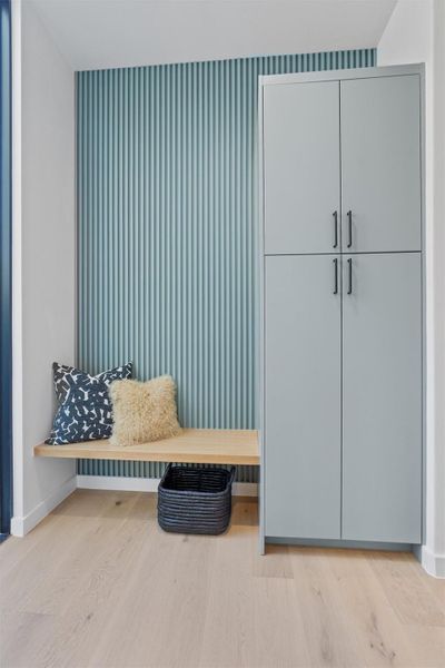 The mud room transition from the garage into the living space offers the ultimate in functional elegance