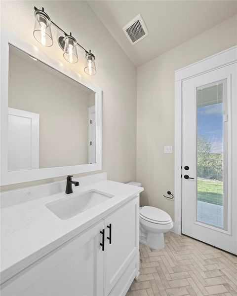 Bathroom with vanity and toilet