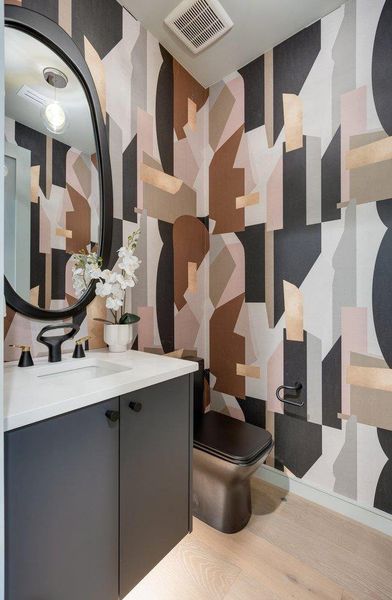 The 1st Floor powder room features is a jewel! Designer wall paper you didn't see coming. Cool factor off the charts.