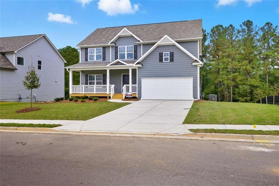 Front exterior of a new home in Creekside Landing, Dallas, GA, highlighting curb appeal (Image 17).