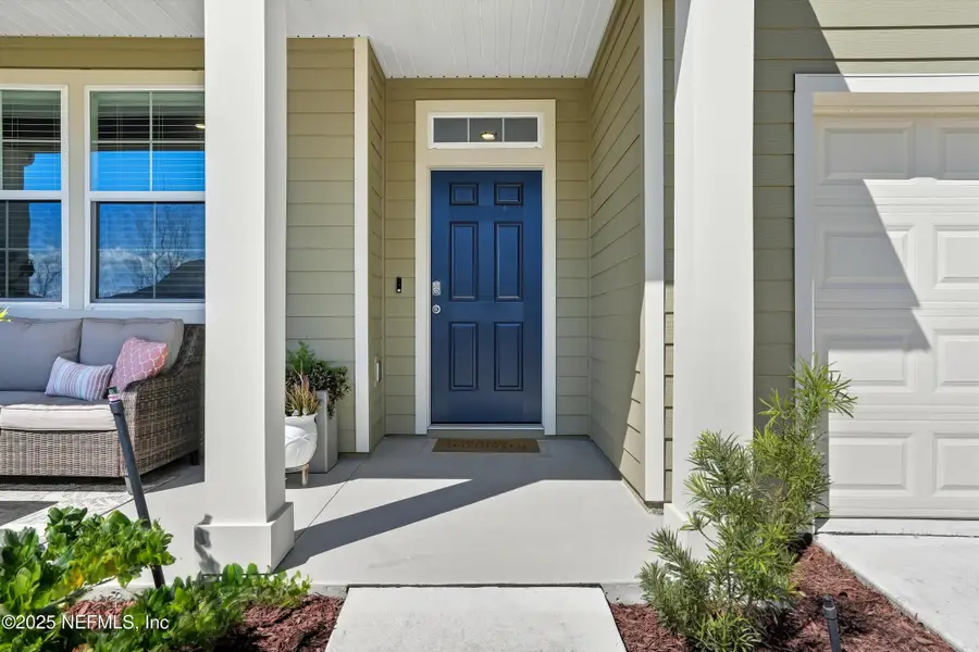 Exterior details and patio area of a home in Cross Creek Express, Green Cove Springs (Image 3).