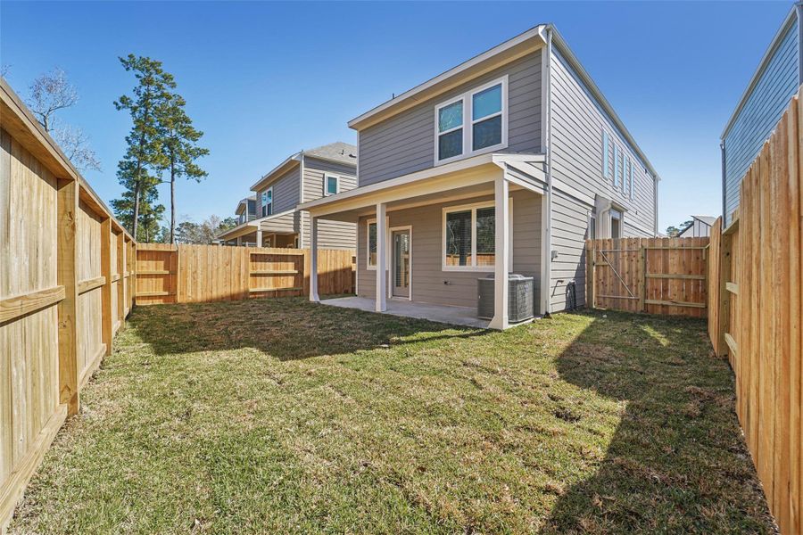 Exterior details and patio area of a home in Pinewood Trails - City Series, Atascocita (Image 3).
