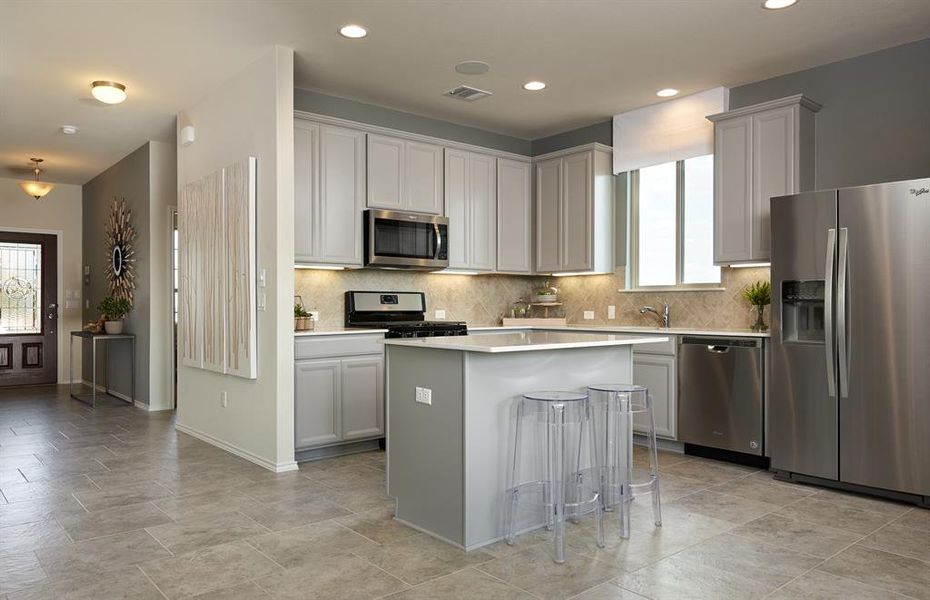 *Model Representation - Spacious kitchen with eat-in bartop island *Model Representation - Spacious kitchen with eat-in bartop island