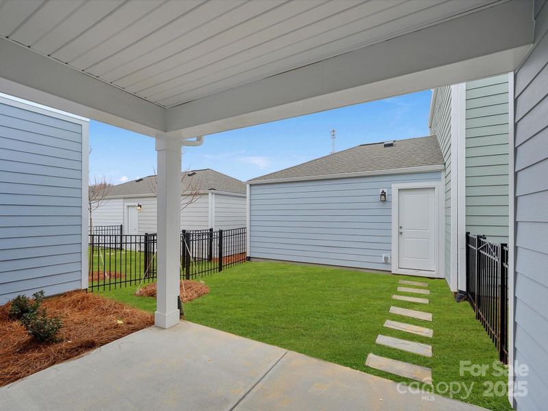 Exterior details and patio area of a home in North Creek Village, Huntersville (Image 19).