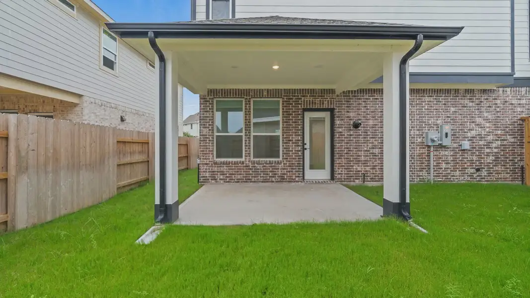 Exterior details and patio area of a home in Elyson Courtyard Collection, Katy (Image 3).