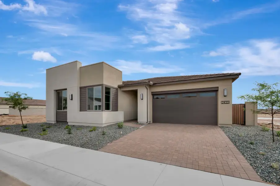 Front exterior of a new home in Soleo, San Tan Valley, AZ, highlighting curb appeal (Image 24).