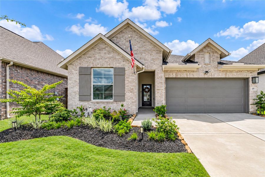 Front exterior of a new home in Brookewater - Terrace Collection, Rosenberg, TX, highlighting curb appeal (Image 2). Front exterior of a new home in Brookewater - Terrace Collection, Rosenberg, TX, highlighting curb appeal (Image 2).