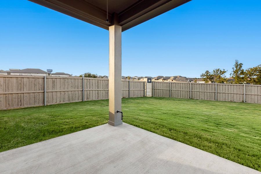 Exterior details and patio area of a home in The Colony, Bastrop (Image 3).