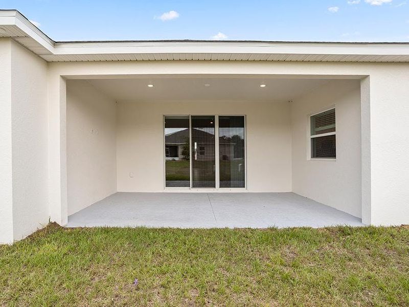 Enjoy outdoor living on your large covered lanai - Everly by Highland Homes