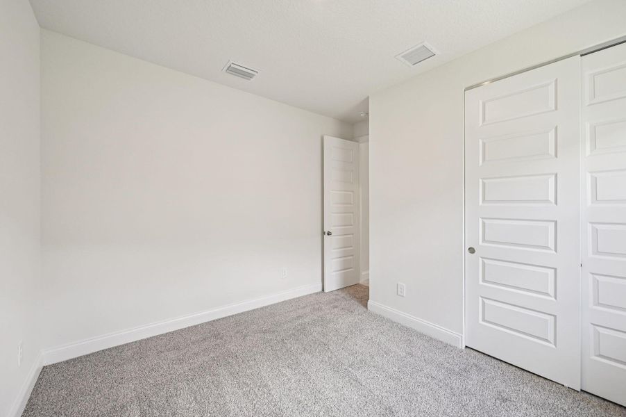 Spacious, unfurnished interior of a new home in Hampton Park - Signature Series, Vero Beach (Image 17). Spacious, unfurnished interior of a new home in Hampton Park - Signature Series, Vero Beach (Image 17).