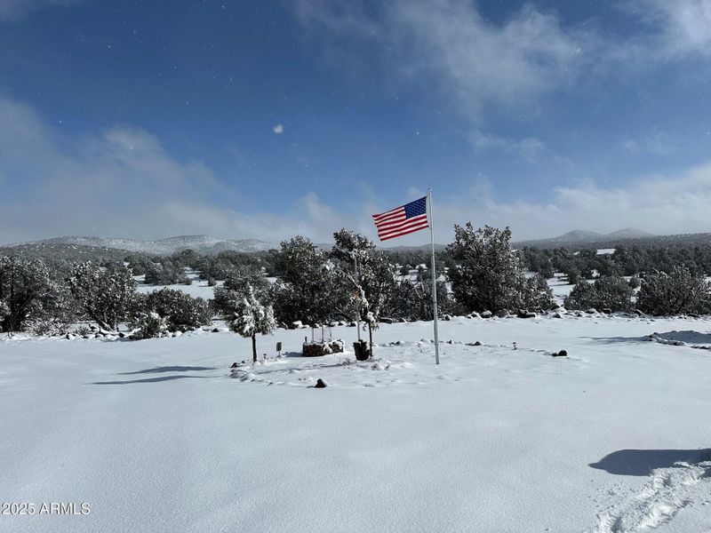 snow covered entry with flagpole snow covered entry with flagpole