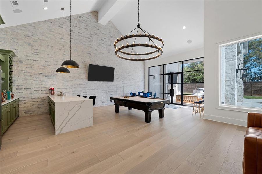 Rec room featuring pool table, beam ceiling, high vaulted ceiling, light wood-style floors, and recessed lighting