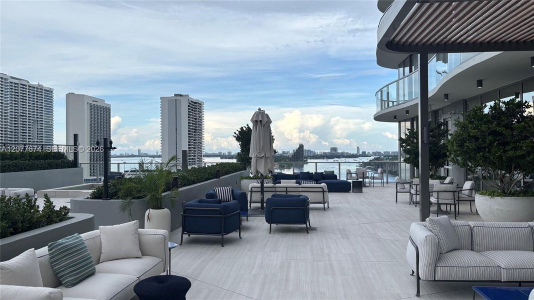 Designer-Furnished Poolside Lounge with Bay Views Designer-Furnished Poolside Lounge with Bay Views