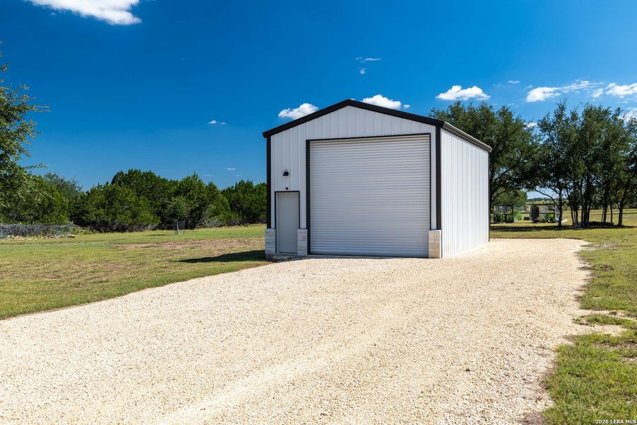 Front exterior of a new home in , Bandera, TX, highlighting curb appeal (Image 23).