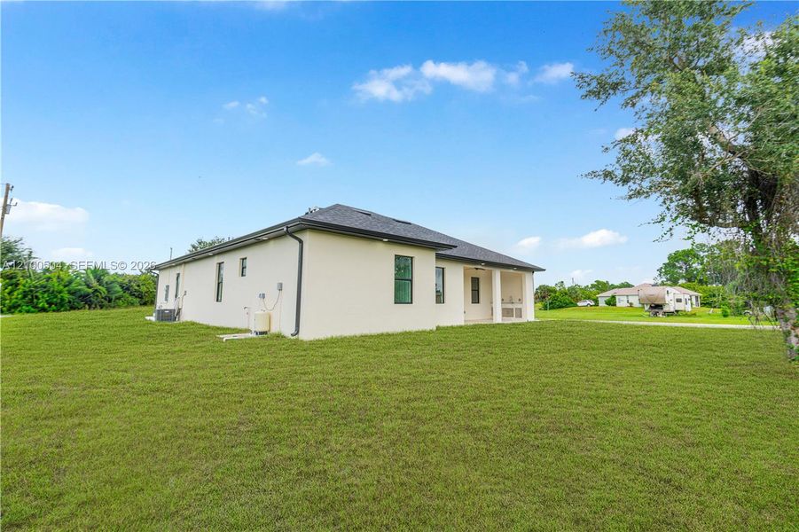 Exterior details and patio area of a home in , Lehigh Acres (Image 30). Exterior details and patio area of a home in , Lehigh Acres (Image 30).