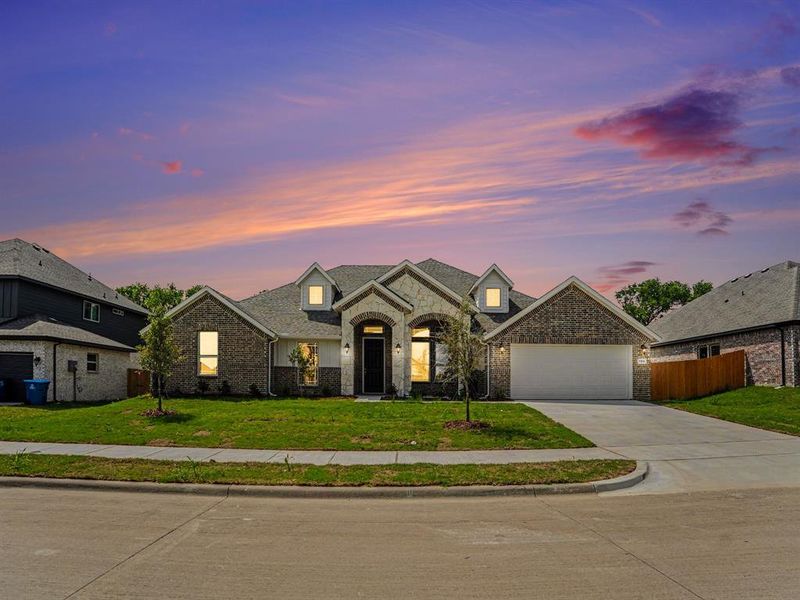 Front exterior of a new home in Cole Crossing Estates, DeSoto, TX, highlighting curb appeal (Image 1). Front exterior of a new home in Cole Crossing Estates, DeSoto, TX, highlighting curb appeal (Image 1).