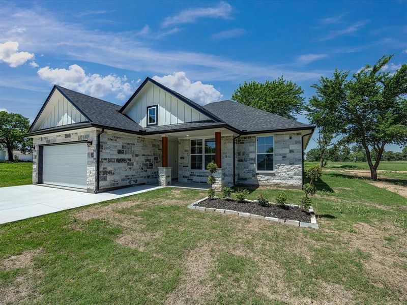 Front exterior of a new home in , Bowie, TX, highlighting curb appeal (Image 18).