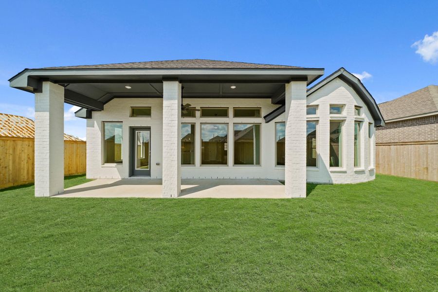 Front exterior of a new home in Bridgeland 55', Cypress, TX, highlighting curb appeal (Image 2). Front exterior of a new home in Bridgeland 55', Cypress, TX, highlighting curb appeal (Image 2).