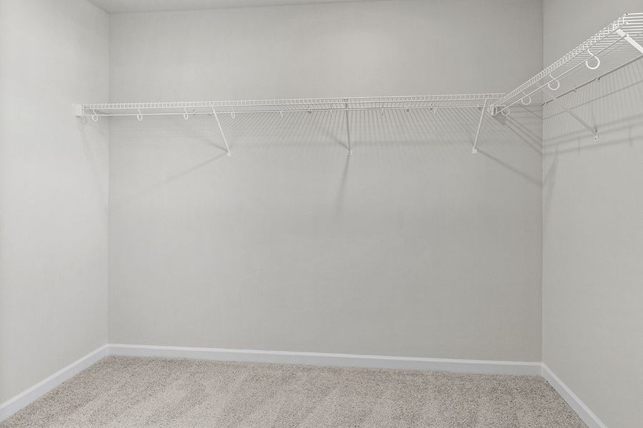 A white wall with a metal railing. A white wall with a metal railing.