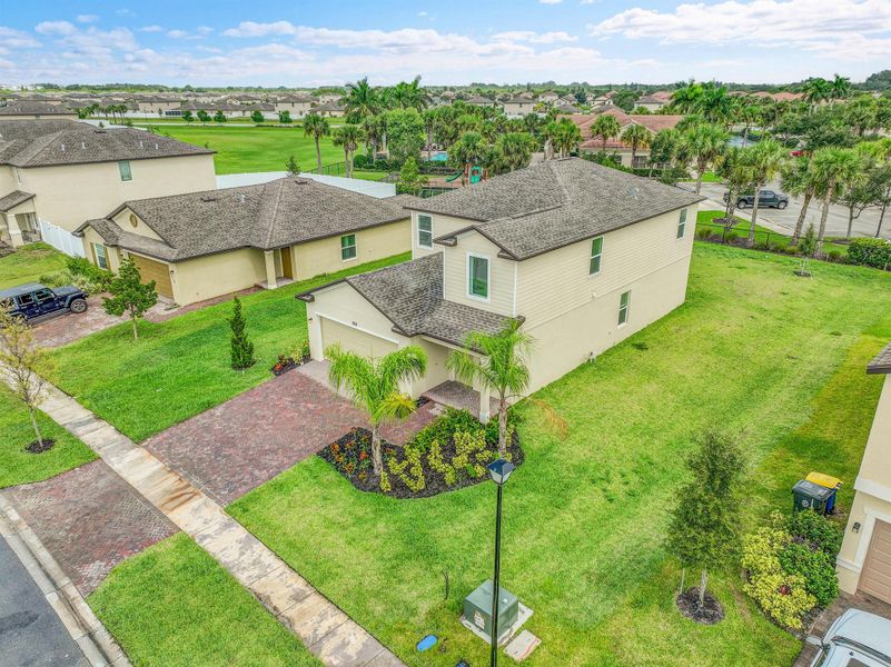 Front exterior of a new home in Bent Creek: The Meadows Collection, Fort Pierce, FL, highlighting curb appeal (Image 1).