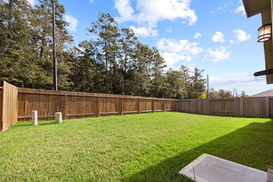 Exterior details and patio area of a home in Enclave at Dobbin, Magnolia (Image 4). Exterior details and patio area of a home in Enclave at Dobbin, Magnolia (Image 4).