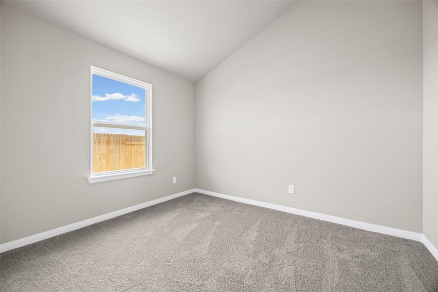 Vaulted ceilings and plush carpeting define this inviting secondary bedroom space. Vaulted ceilings and plush carpeting define this inviting secondary bedroom space.