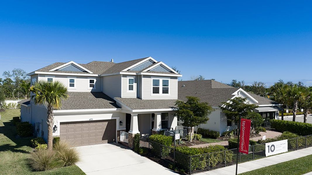 Front exterior of a new home in Veranda Oaks, Port St. Lucie, FL, highlighting curb appeal (Image 15).