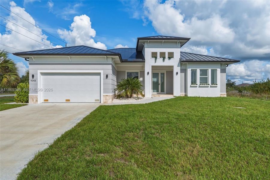 Front exterior of a new home in , Port Charlotte, FL, highlighting curb appeal (Image 2). Front exterior of a new home in , Port Charlotte, FL, highlighting curb appeal (Image 2).