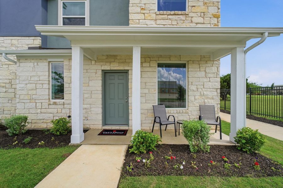 Exterior details and patio area of a home in Municipal Drive Townhomes, Leander (Image 3). Exterior details and patio area of a home in Municipal Drive Townhomes, Leander (Image 3).