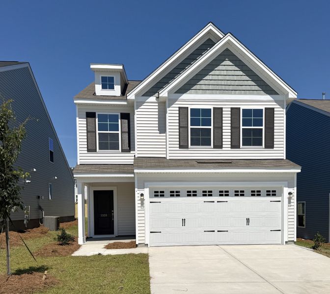 Front exterior of a new home in Ellington, Elgin, SC, highlighting curb appeal (Image 1). Front exterior of a new home in Ellington, Elgin, SC, highlighting curb appeal (Image 1).