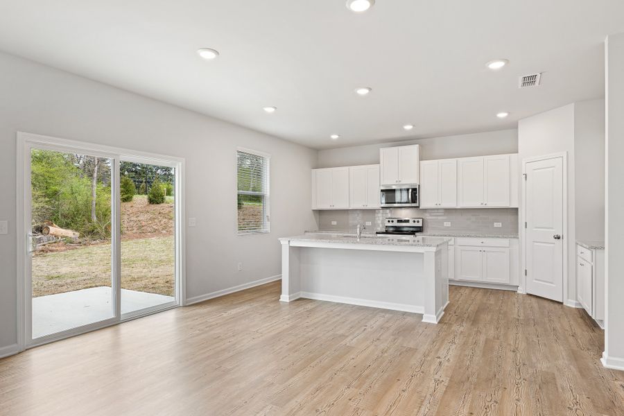 A kitchen with white cabinets. A kitchen with white cabinets.