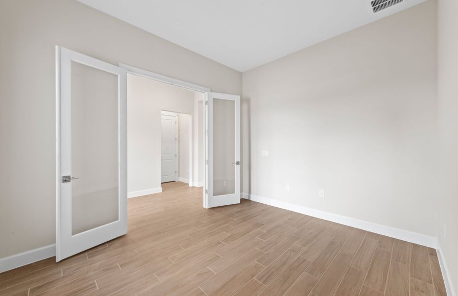 Enclosed flex room featuring elegant French doors