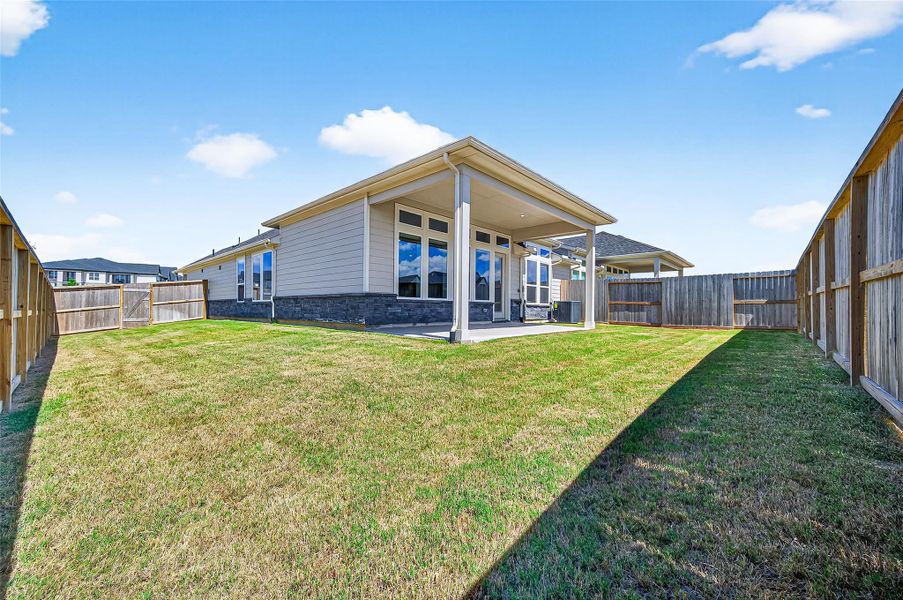 Exterior details and patio area of a home in Jordan Ranch: Signature Series, Katy (Image 26).