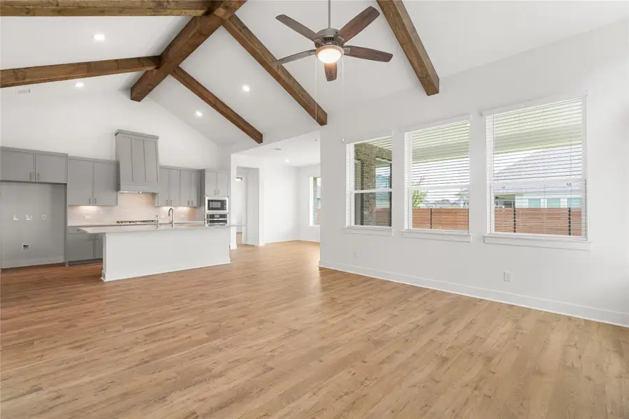 An open-concept living space complemented by a modern kitchen. An open-concept living space complemented by a modern kitchen.
