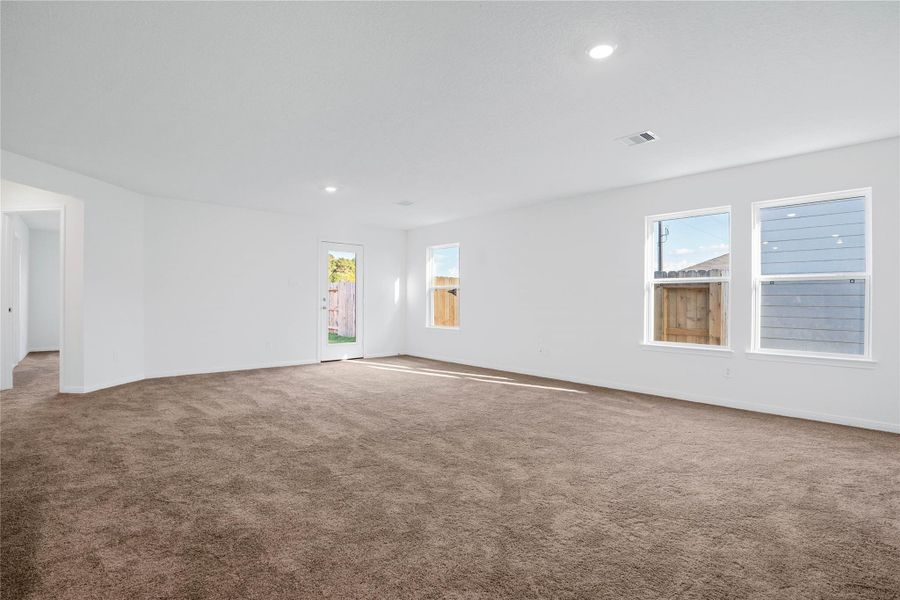 Additional view of the Great Room showing access door to the back yard space. Additional view of the Great Room showing access door to the back yard space.