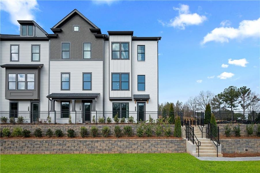 Front exterior of a new home in Barrett Pointe, Kennesaw, GA, highlighting curb appeal (Image 1). Front exterior of a new home in Barrett Pointe, Kennesaw, GA, highlighting curb appeal (Image 1).