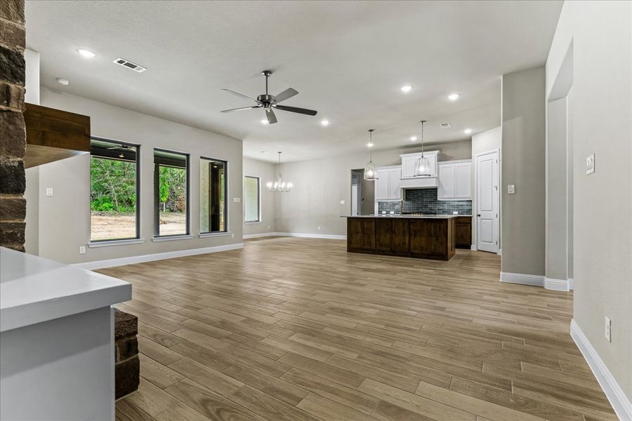 Doug Parr Homes | Hunter Plan - Living Room, Kitchen, Breakfast Nook Doug Parr Homes | Hunter Plan - Living Room, Kitchen, Breakfast Nook