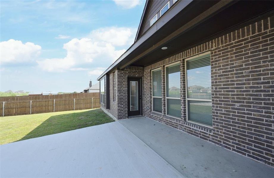 Exterior details and patio area of a home in Coyote Crossing, Godley (Image 3).
