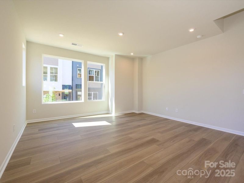 Great room with 9' ceilings to make the space feel grand and open.