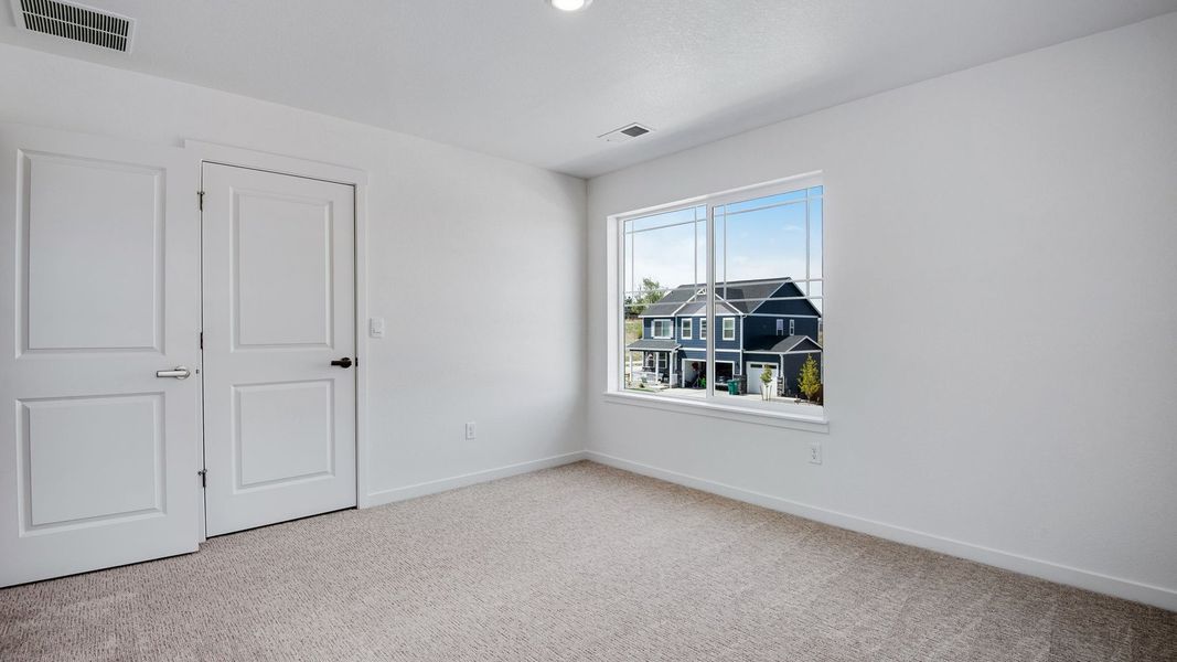 Spacious, unfurnished interior of a new home in Trails at Crowfoot, Parker (Image 46).