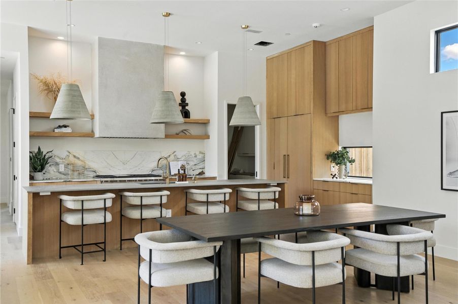 Dining area featuring light wood finished floors and recessed lighting Dining area featuring light wood finished floors and recessed lighting