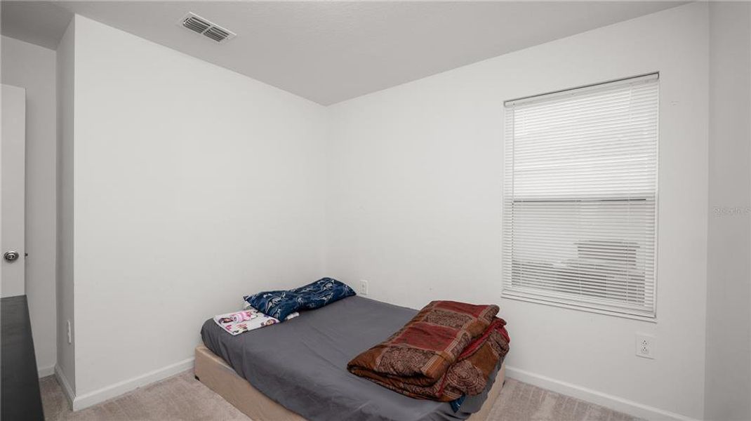 Furnished interior view inside a new home in Peace Creek Reserve: Legacy Collection, Winter Haven (Image 10).
