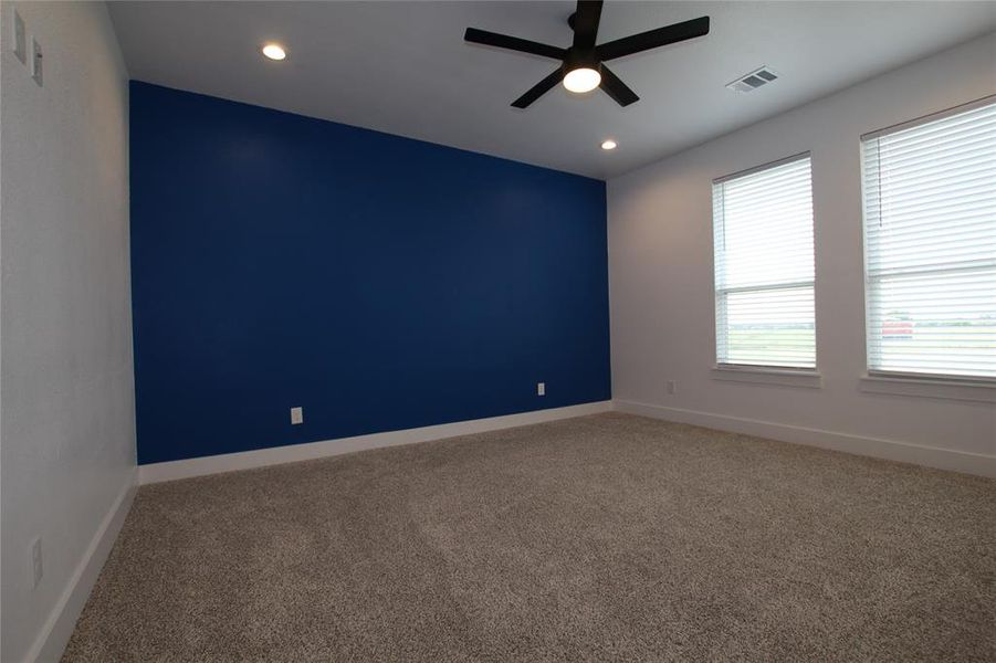 Carpeted spare room with ceiling fan and recessed lighting Carpeted spare room with ceiling fan and recessed lighting