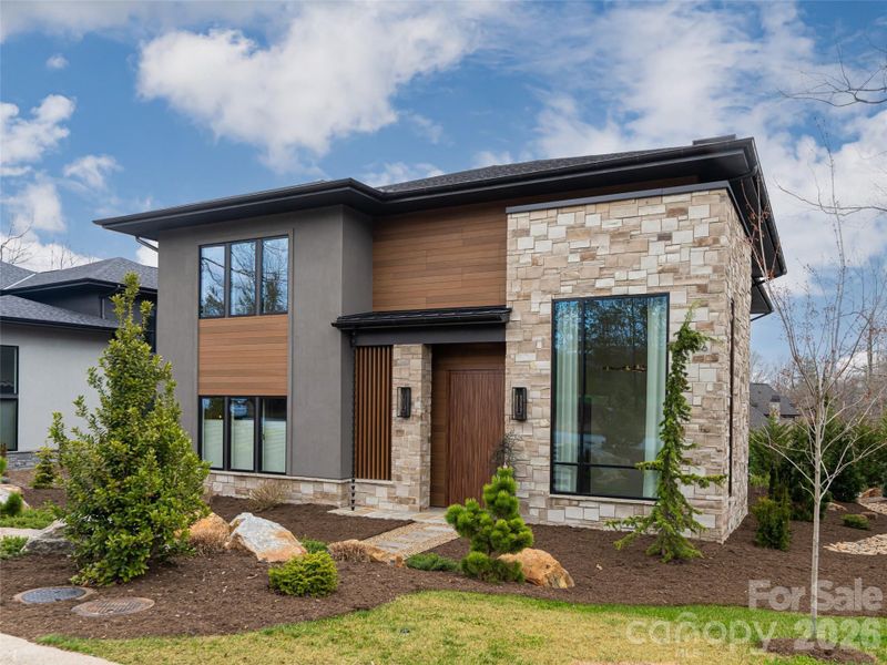 Front exterior of a new home in , Arden, NC, highlighting curb appeal (Image 27).