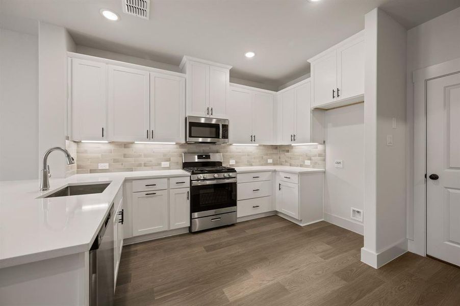 Neutral color cabinets paired with a stylish backsplash and modern stainless steel create the kitchen of your dreams Neutral color cabinets paired with a stylish backsplash and modern stainless steel create the kitchen of your dreams