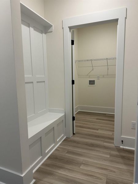 Mudroom with light wood-style floors